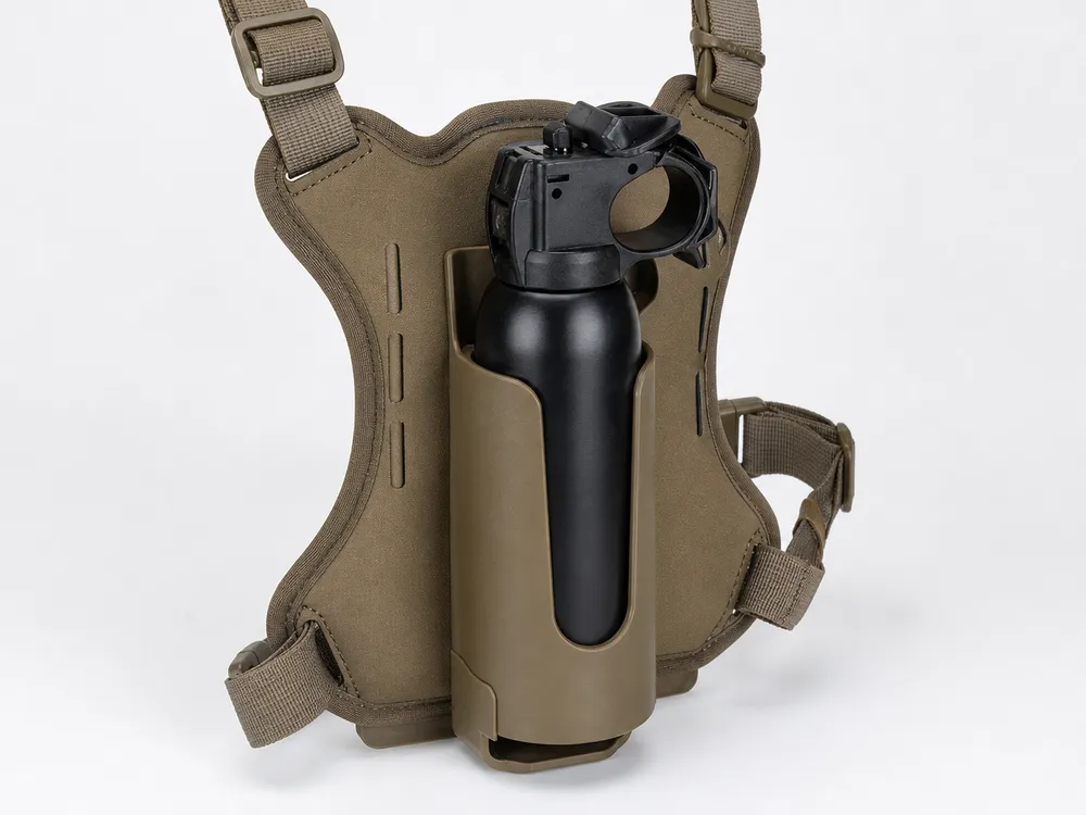 SOHAPI bear spray canister seated in chest holster — retention geometry spec'd to canister dimensions
