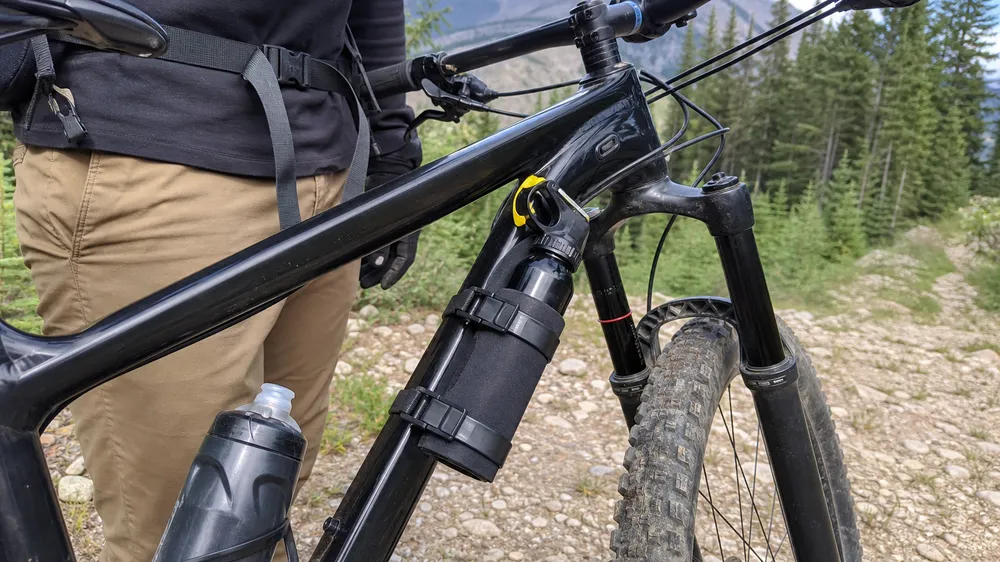 Bear spray holster for mountain bike — frame-mount handlebar-mount vibration-resistant