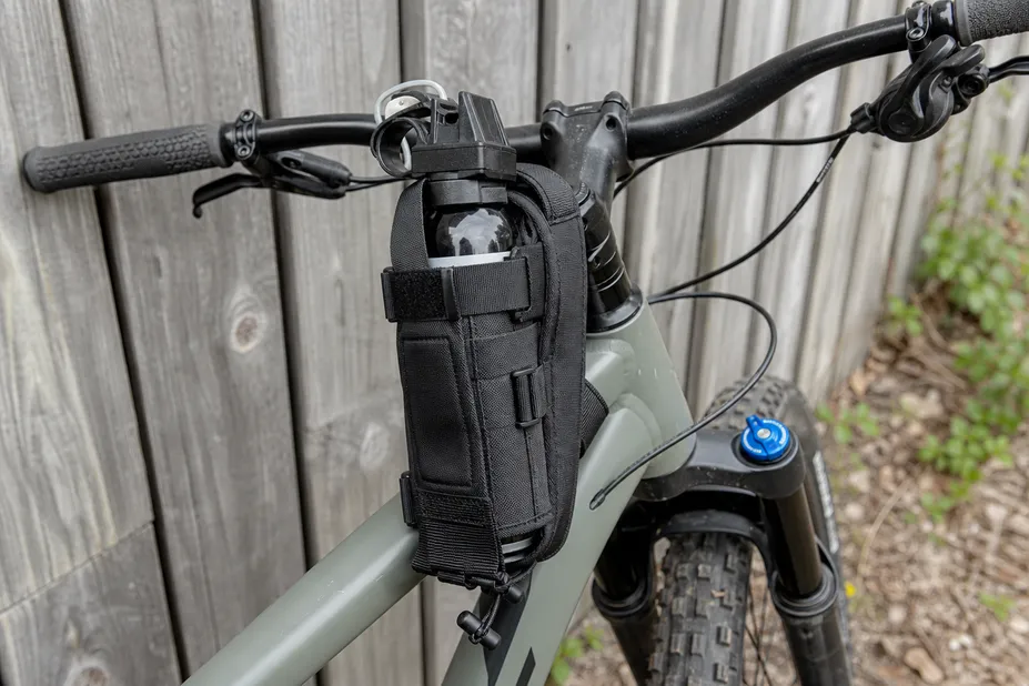 SOHAPI bear spray mountain bike holster mounted on handlebar — vibration-resistant carry system for trail and bikepacking use