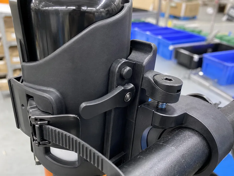 Close-up of the quick-release lever friction detent on the SOHAPI mountain bike bear spray holster retention body