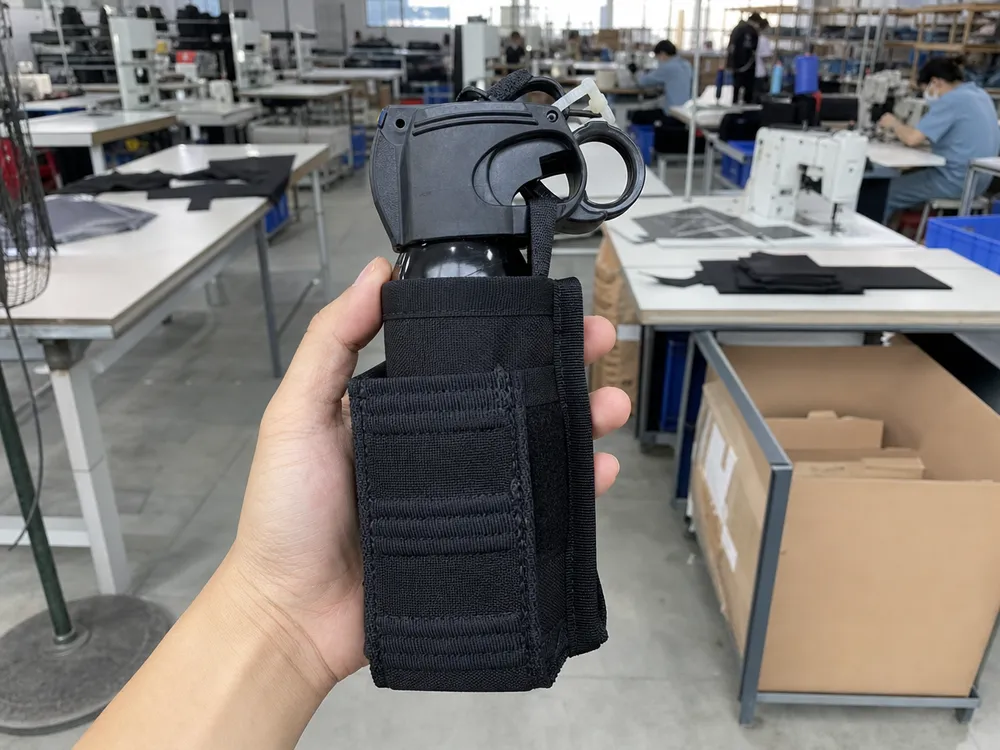 Bear spray holster engineered fit — canister seated in retention system, manufactured in same facility