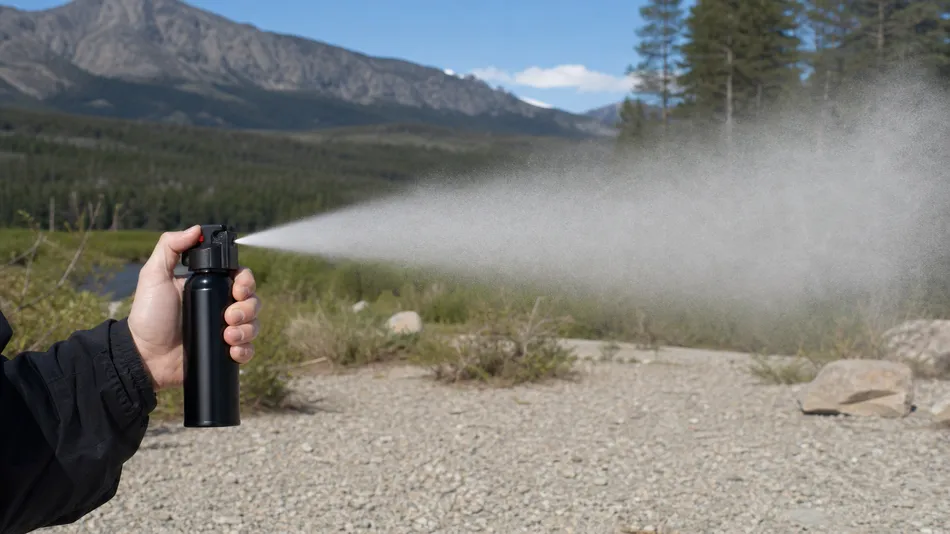 Cone configuration bear spray showing wide coverage pattern for personal protection and outdoor retail channels