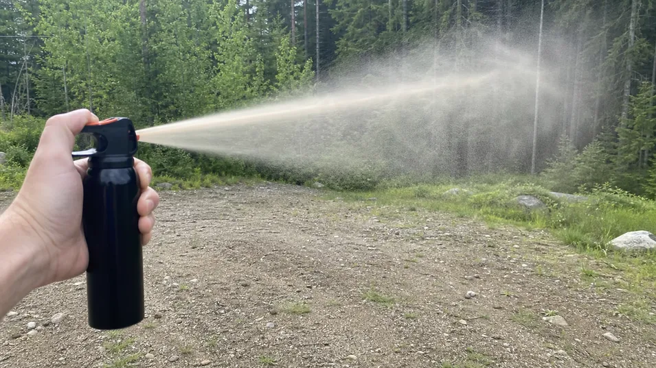 Cone spray pattern configuration for self defense bear spray — wide dispersal at 4–7 metre effective range