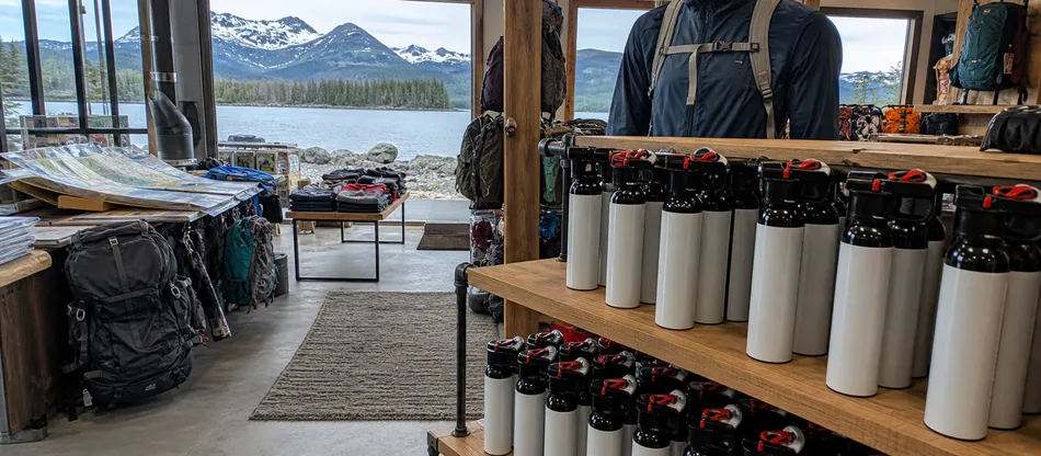 Coastal and alpine outdoor retail environment for foam bear spray distribution
