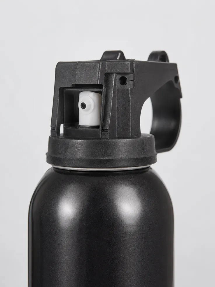 Close-up of Grizzly Bear Spray wide-cone valve and tinplate steel canister construction