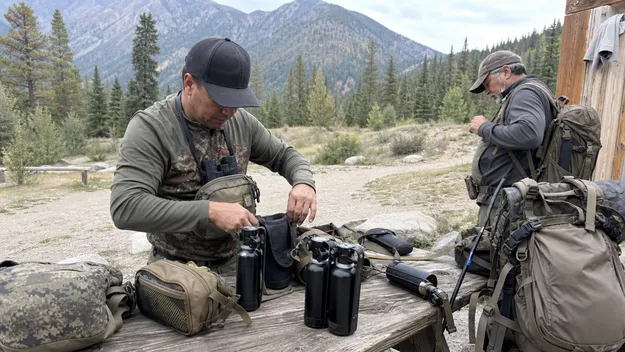 Hunting outfitter and backcountry guide with bear spray equipment