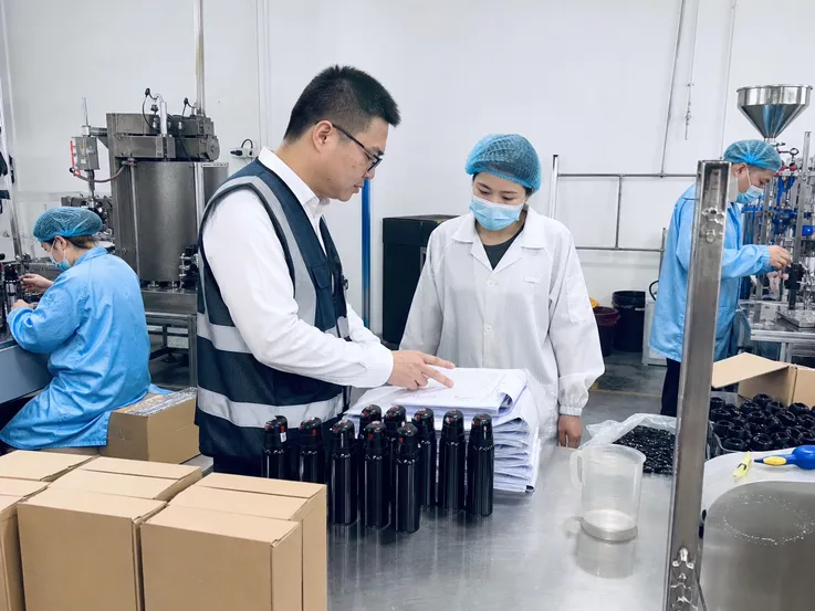 SGS auditor reviewing SOHAPI bear spray manufacturing facility and quality processes