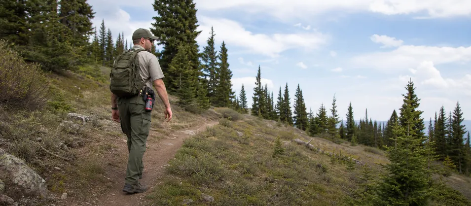 Park ranger with bear spray on patrol in wilderness area