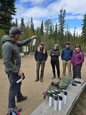 Outdoor education program bear safety curriculum using training bear spray canisters