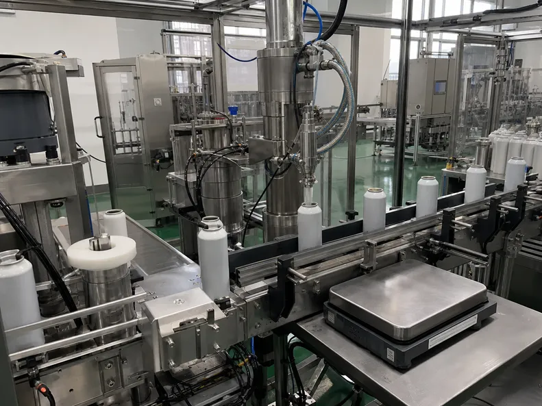 Automated gravimetric fill equipment on the production line for training bear spray canisters